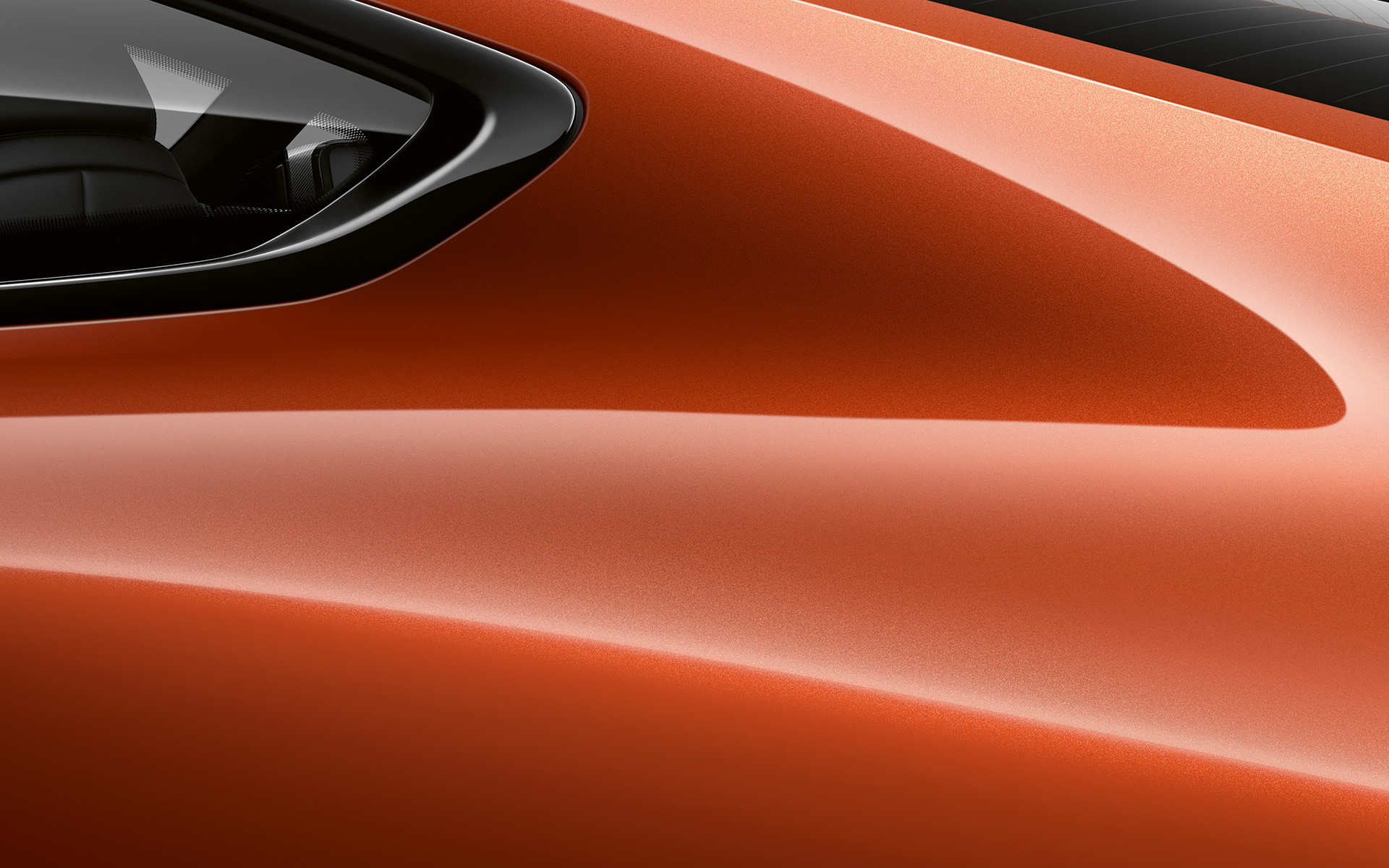 Close-up of the C pillar of the BMW 8 Series Coupé in Sunset Orange metallic.