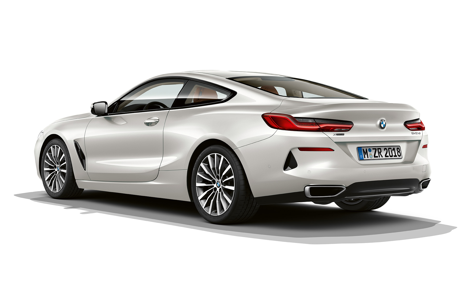 Still shot of the BMW 8 Series Coupé in Bluestone metallic against a white background.